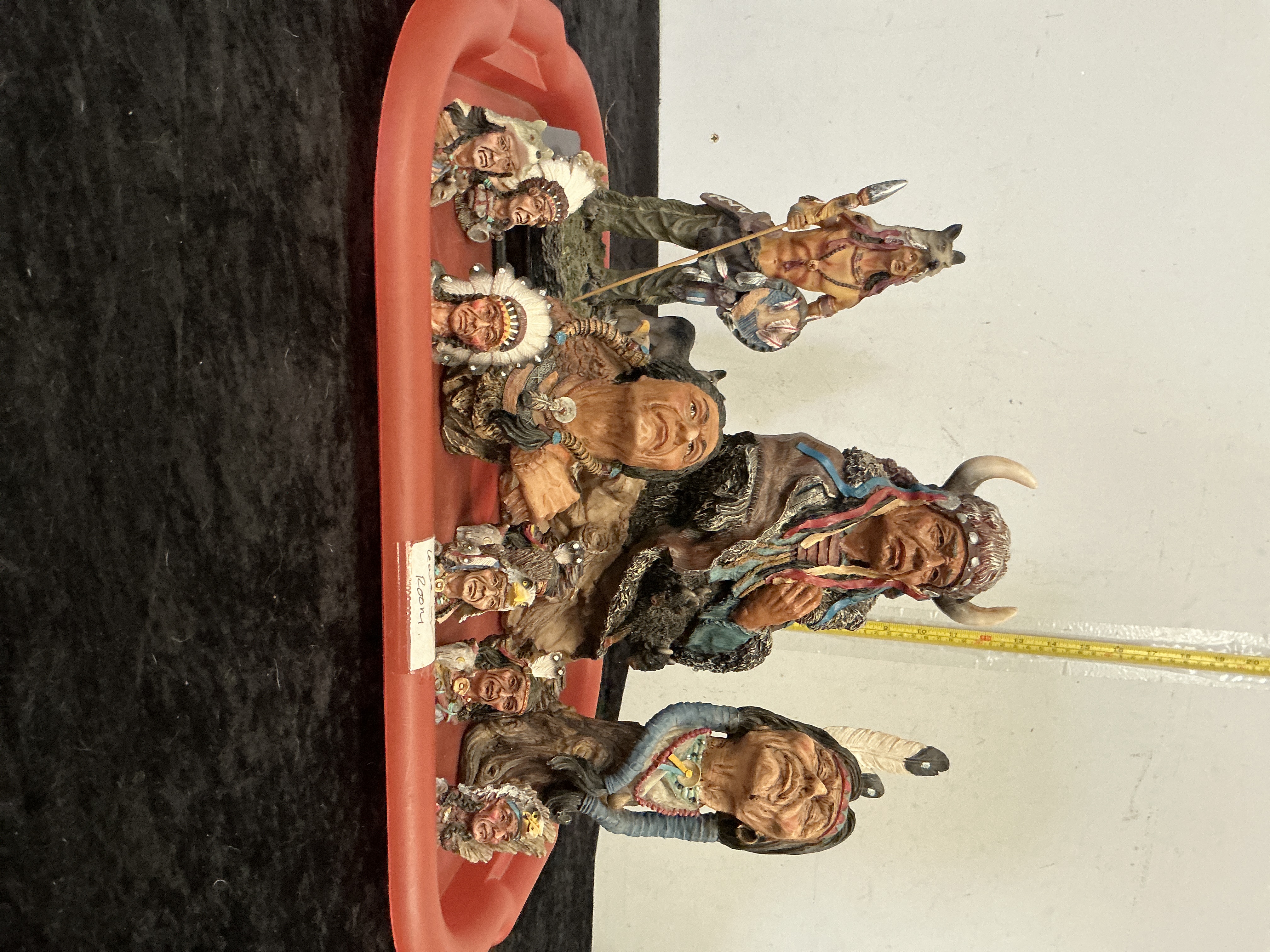 A Collection of Eight Polychrome Resin Native American Themed Figurines and Busts
