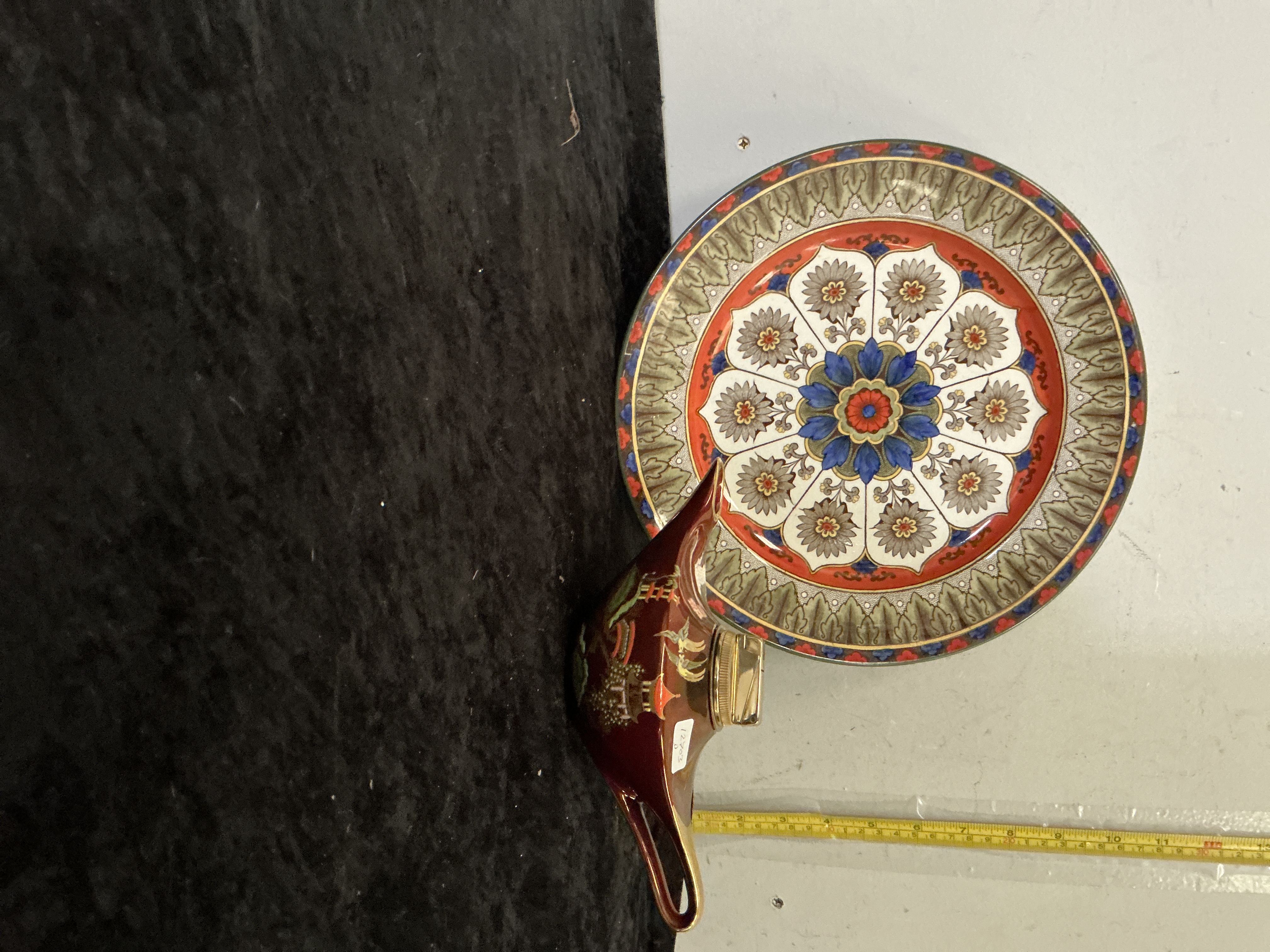Two Pieces of English Ceramics Comprising a Doulton Burslem Kyber Pattern Plate and a Carlton Ware oil lamp lighter