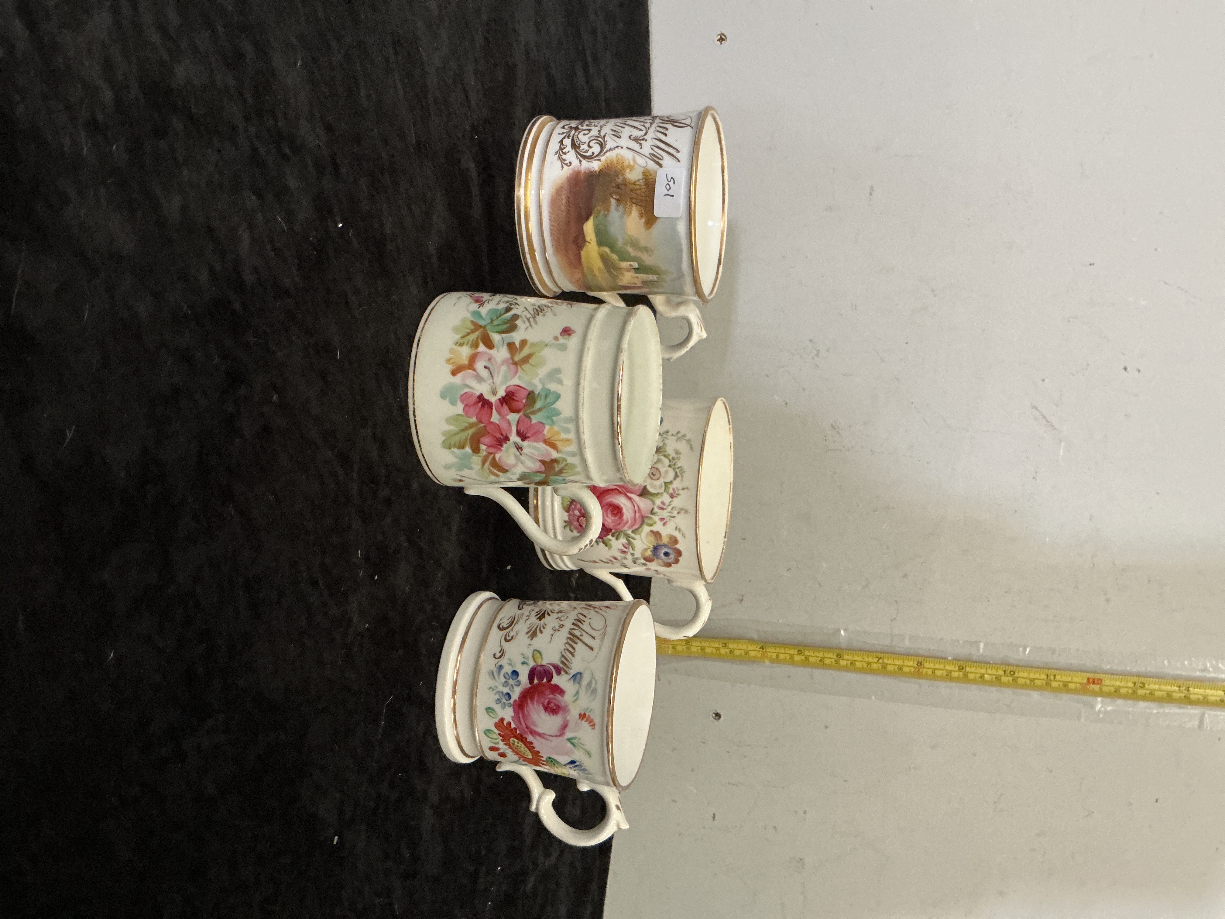 A Group of Four 19th Century Porcelain Souvenir and Floral Mugs