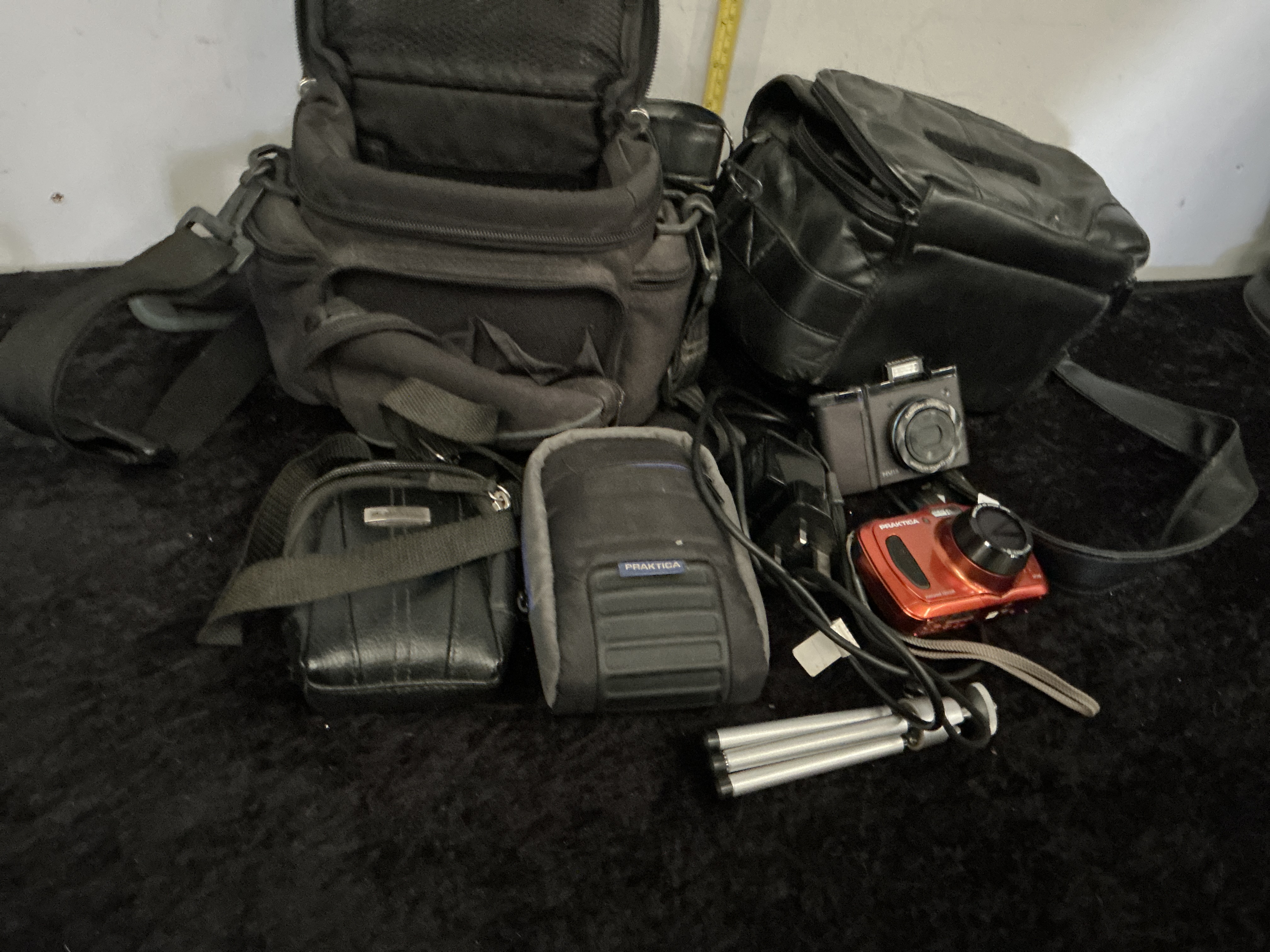 An Assortment of Digital Camera Equipment including Praktica and Samsung Models