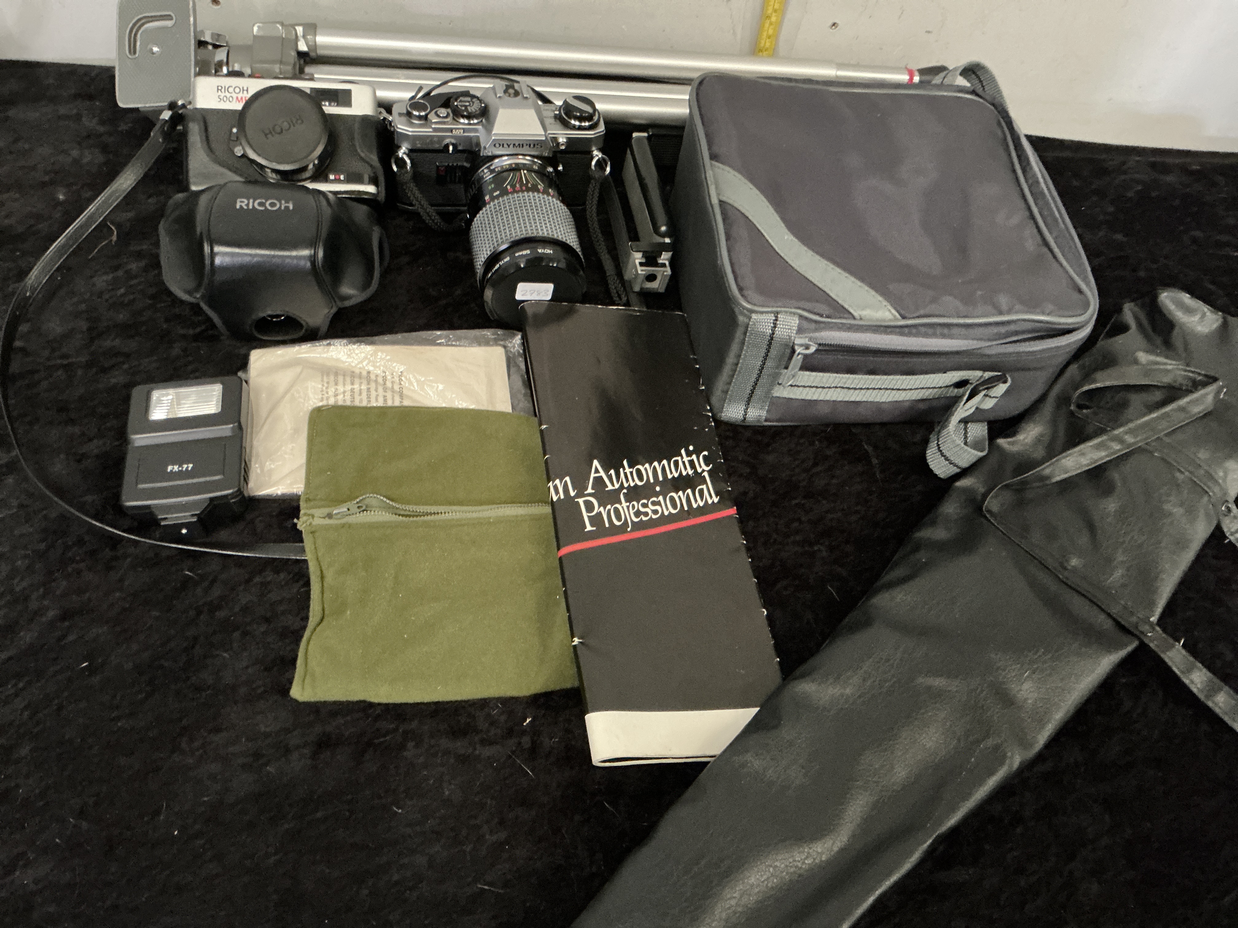 A Collection of Vintage 35mm Film Cameras and Photographic Accessories including Olympus and Ricoh