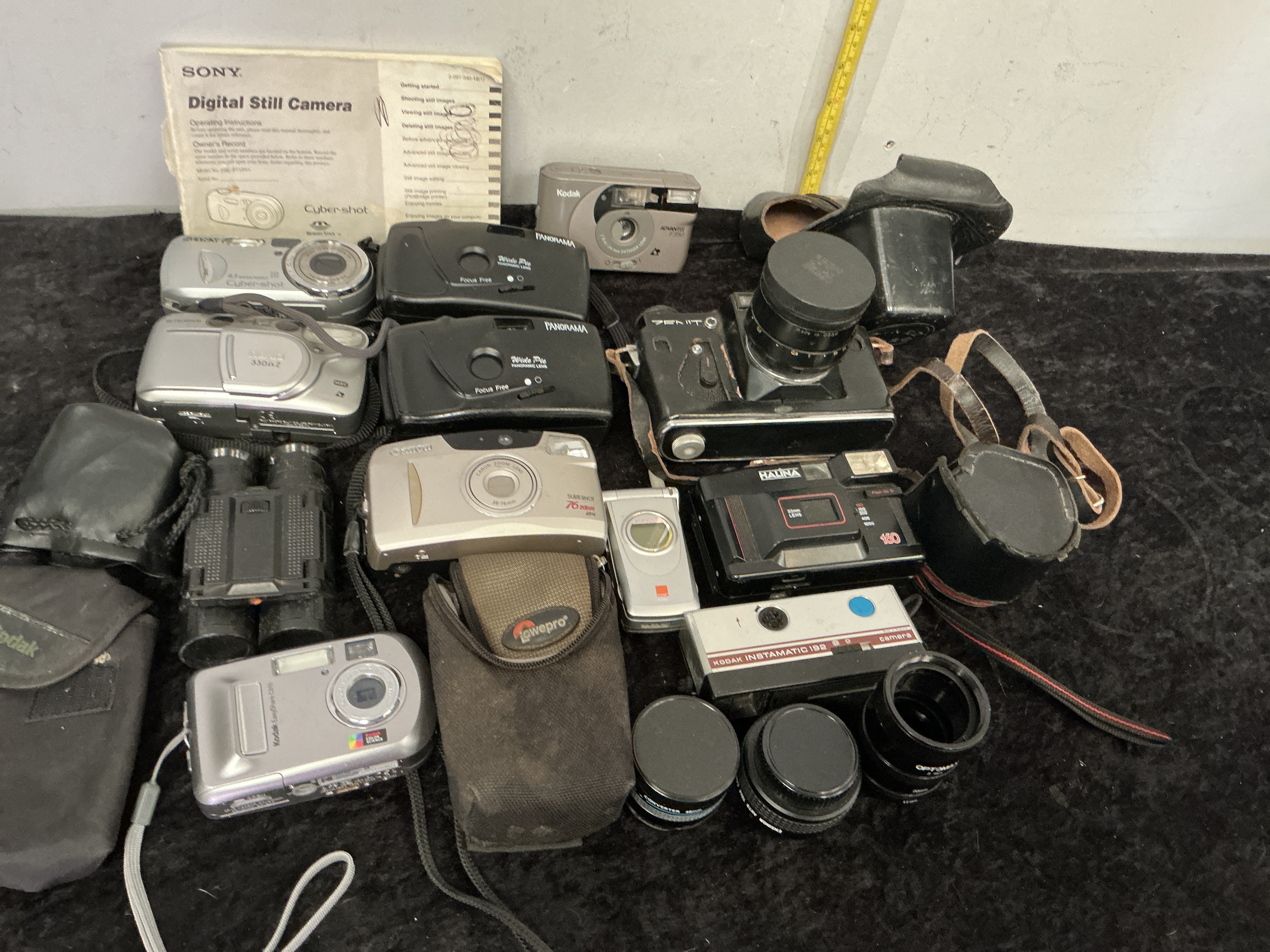 A Collection of Vintage and Modern Cameras, Binoculars, and Photographic Accessories