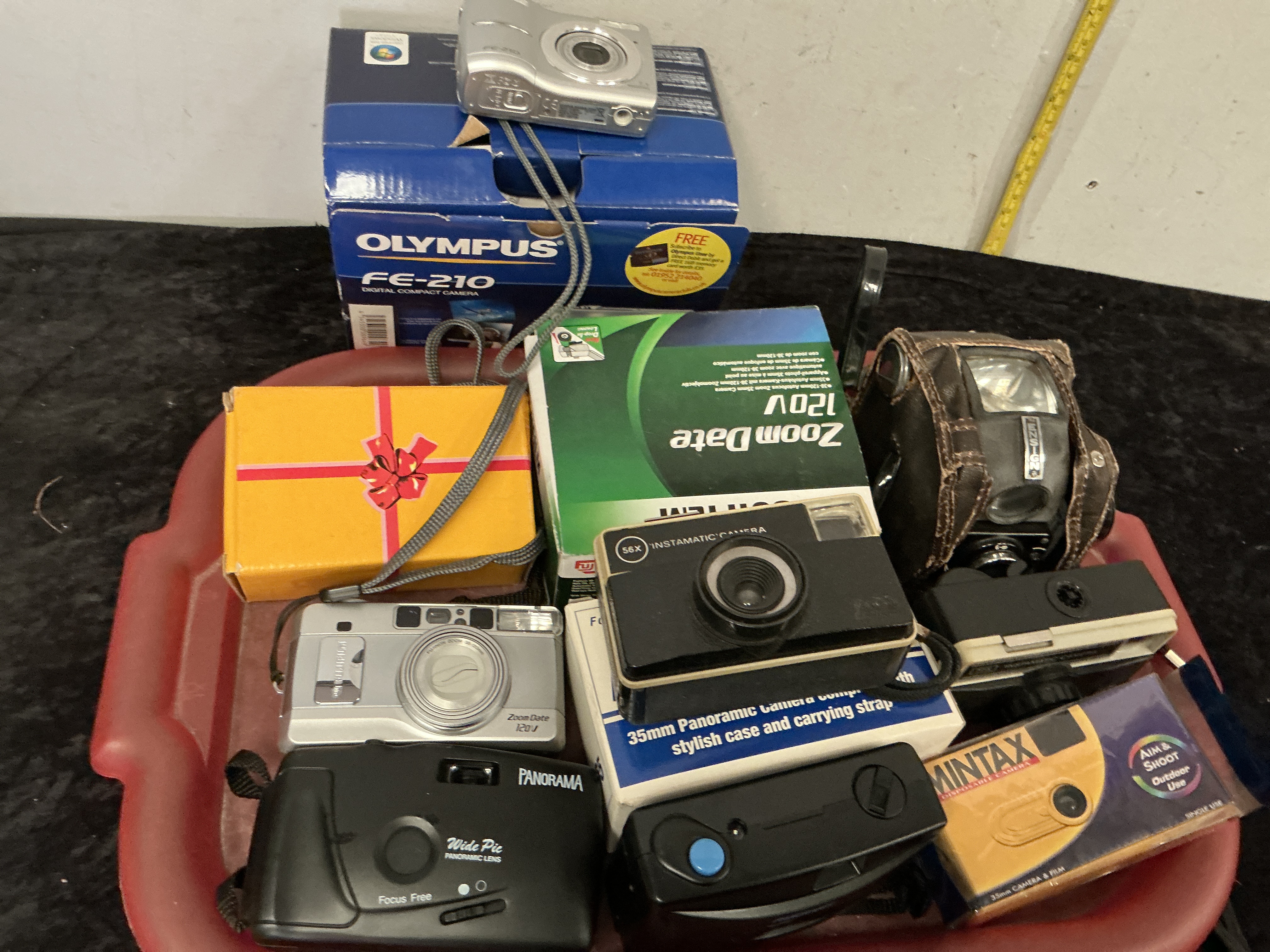 A Collection of Vintage and Modern Compact Cameras including Olympus Fujifilm and Ensign