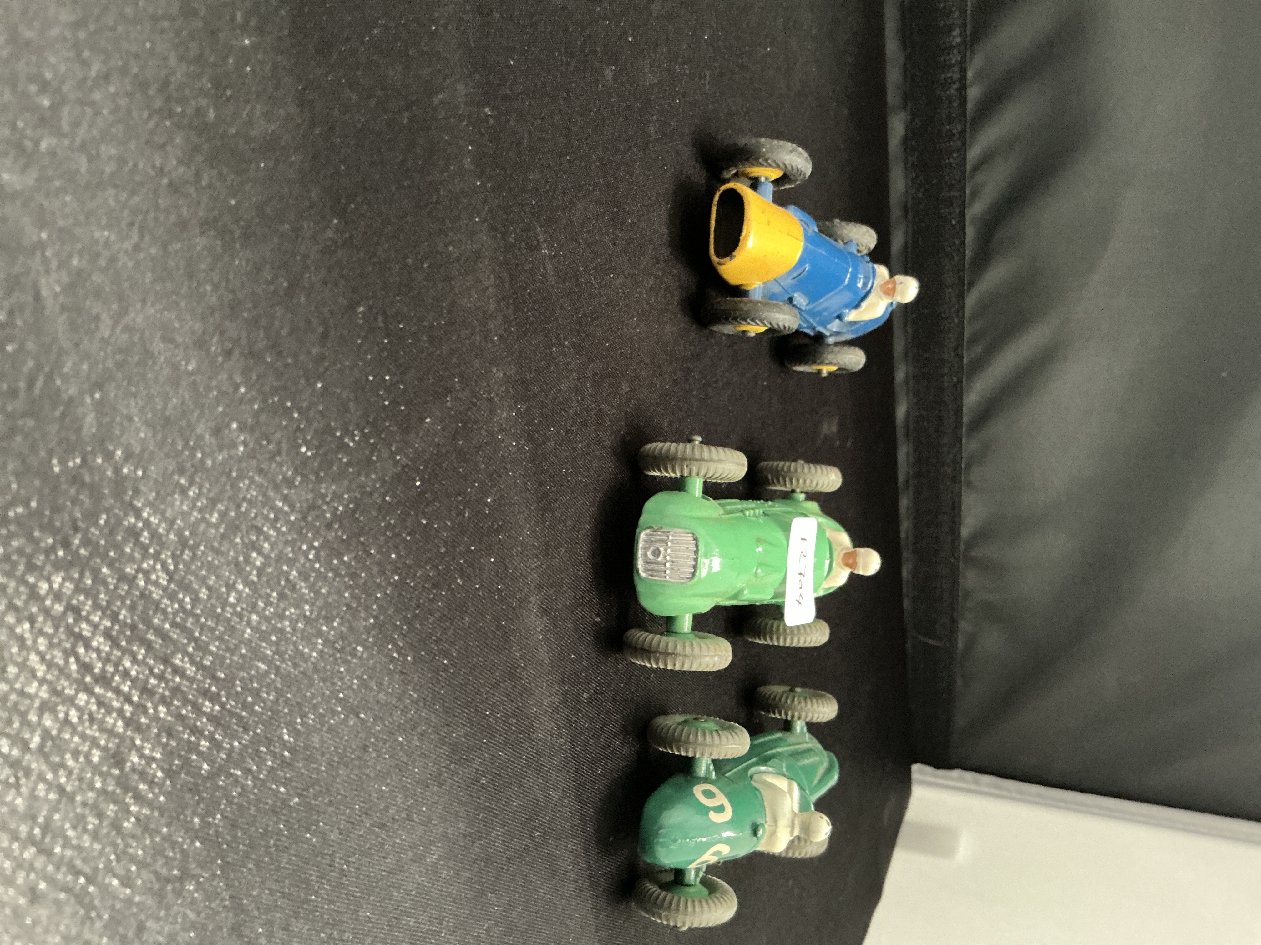 Three Dinky Toys Die-cast Racing Cars including Ferrari, H.W.M., and Cooper-Bristol