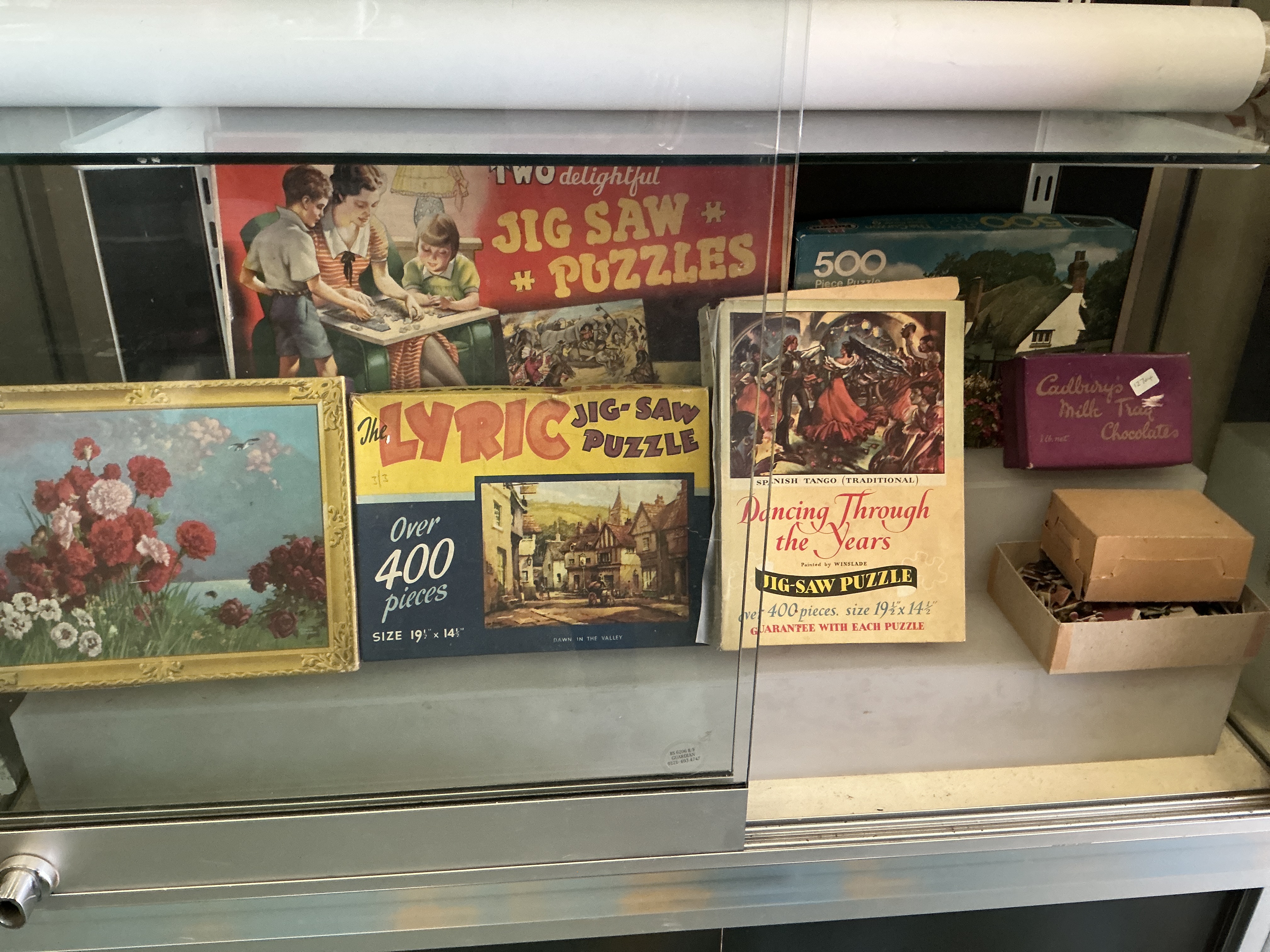 A Collection of Vintage British Jigsaw Puzzles and Ephemera including Lyric and Winslade Illustrated Examples