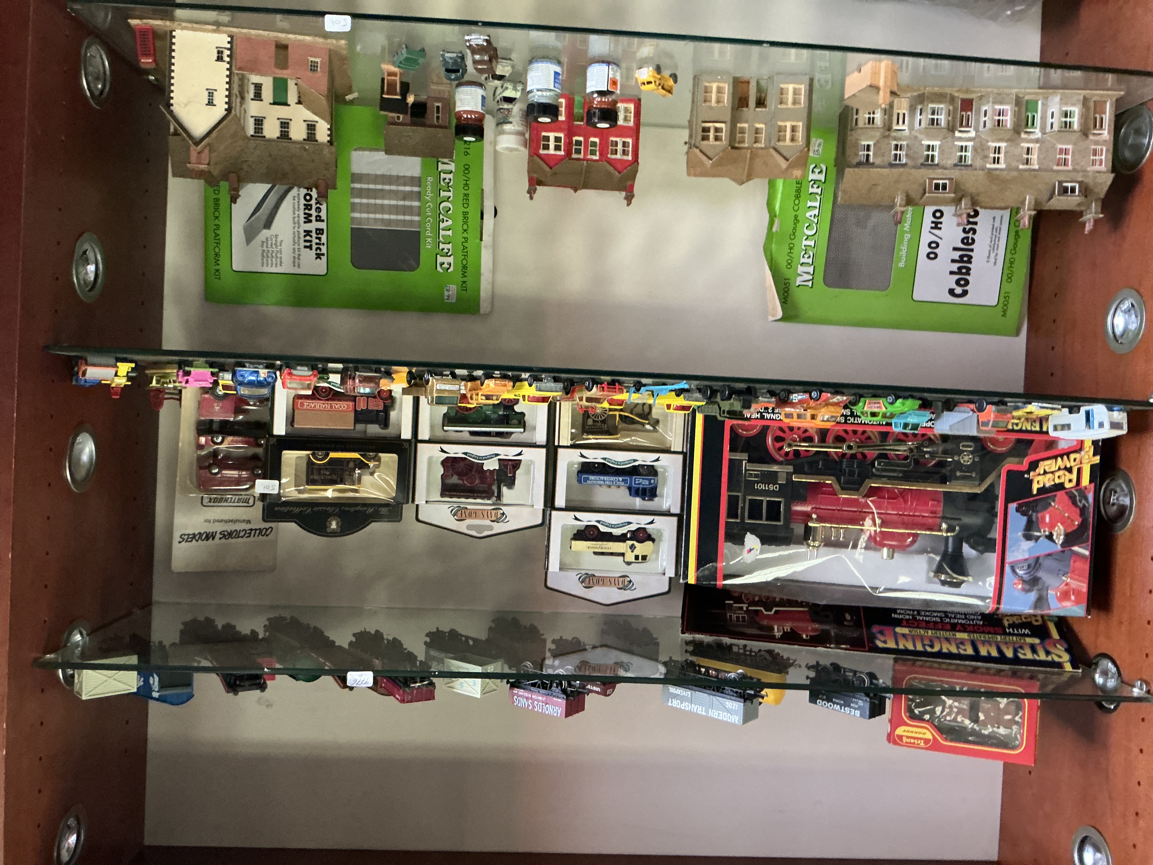 A Collection of Model Vehicles, Railway Accessories, and Kits including Lledo, Matchbox, and Metcalfe