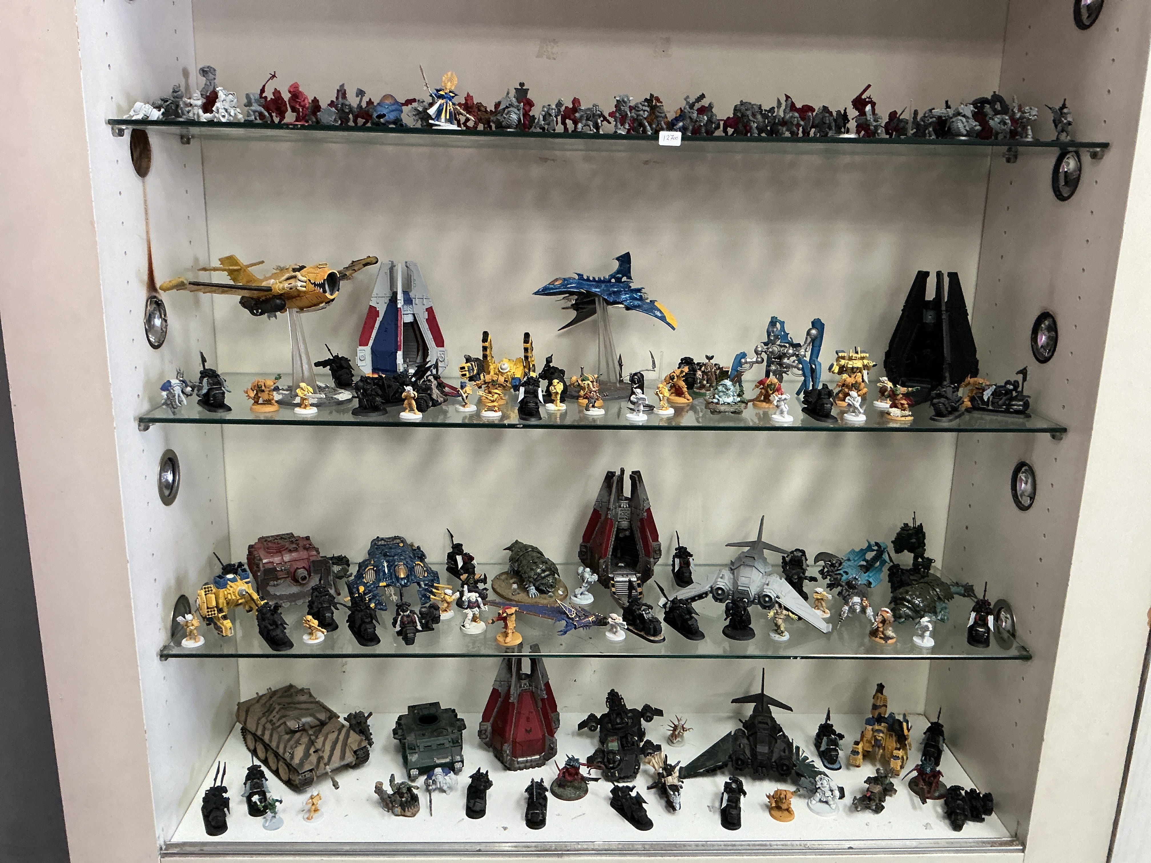 A Collection of Games Workshop Warhammer 40,000 Miniatures and Vehicles