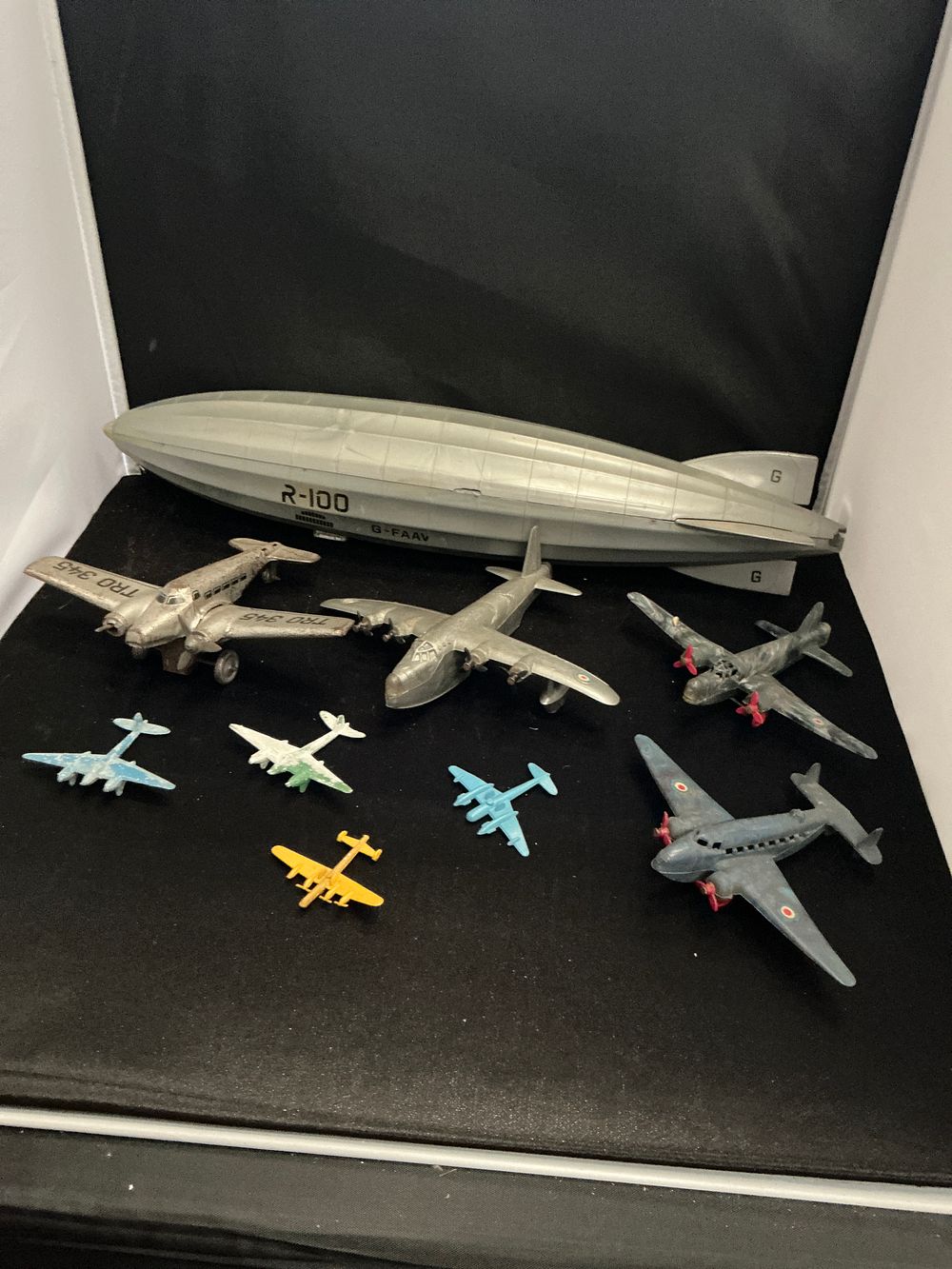 Lot 275: A Collection of Vintage Tinplate and Die-Cast Aircraft including an R100 Airship