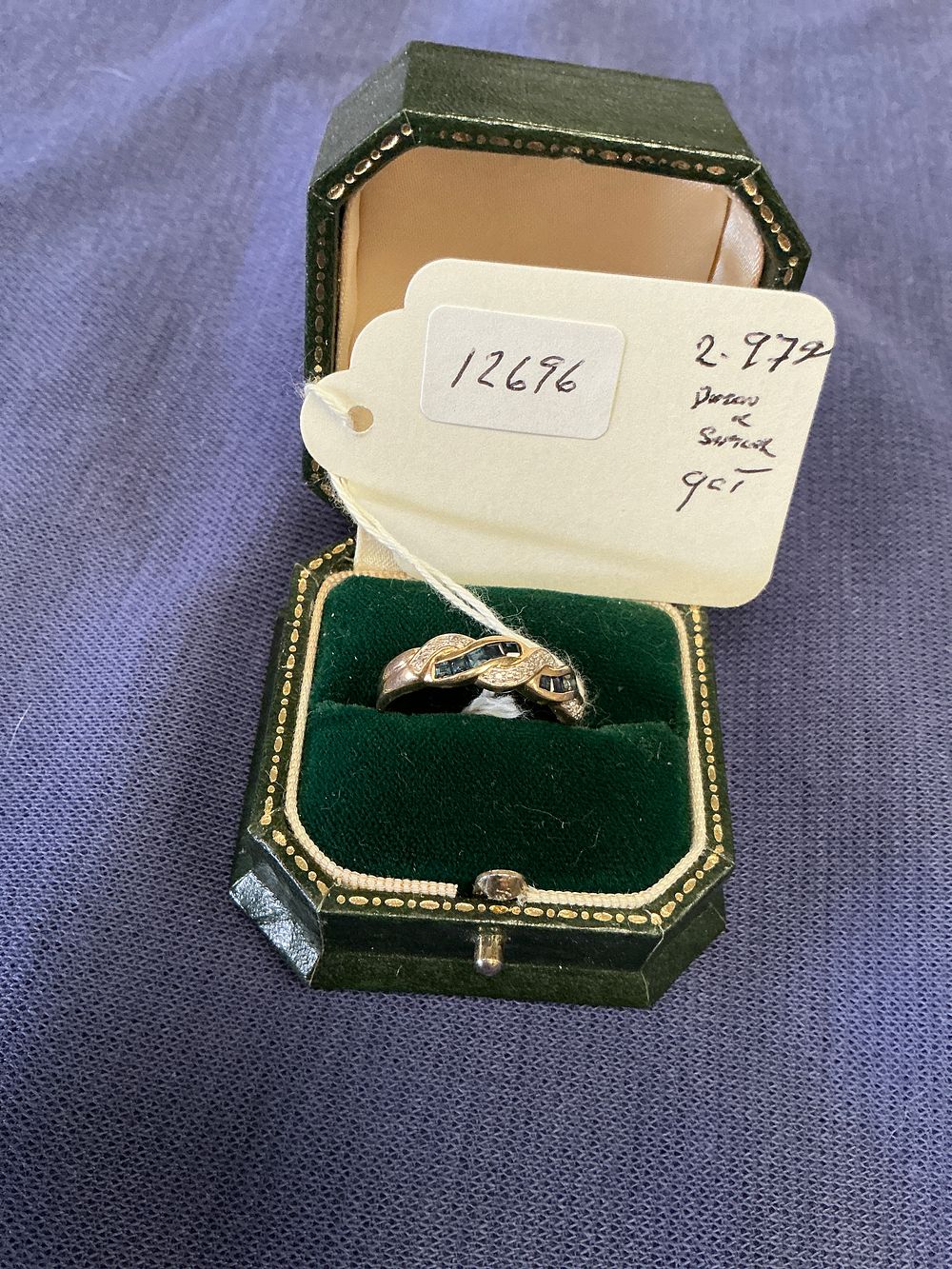 Lot 290: A 9ct Yellow Gold Sapphire and Diamond Crossover Dress Ring