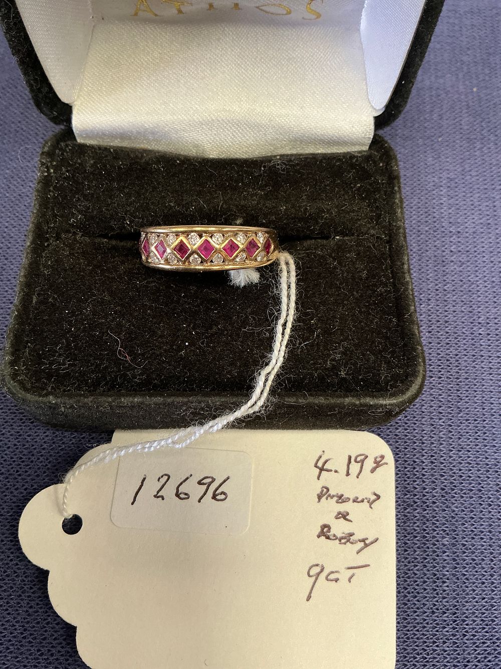 Lot 294: A 9ct Gold Diamond and Ruby Ring