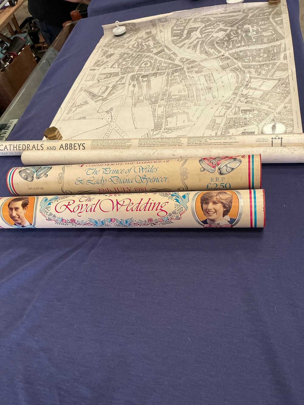 Lot 329: A Trio of Items of Rolled Ephemera comprising a Bartholomew Historic Series Map of Leeds and Two 1981 Royal Wedding Commemorative Tubes