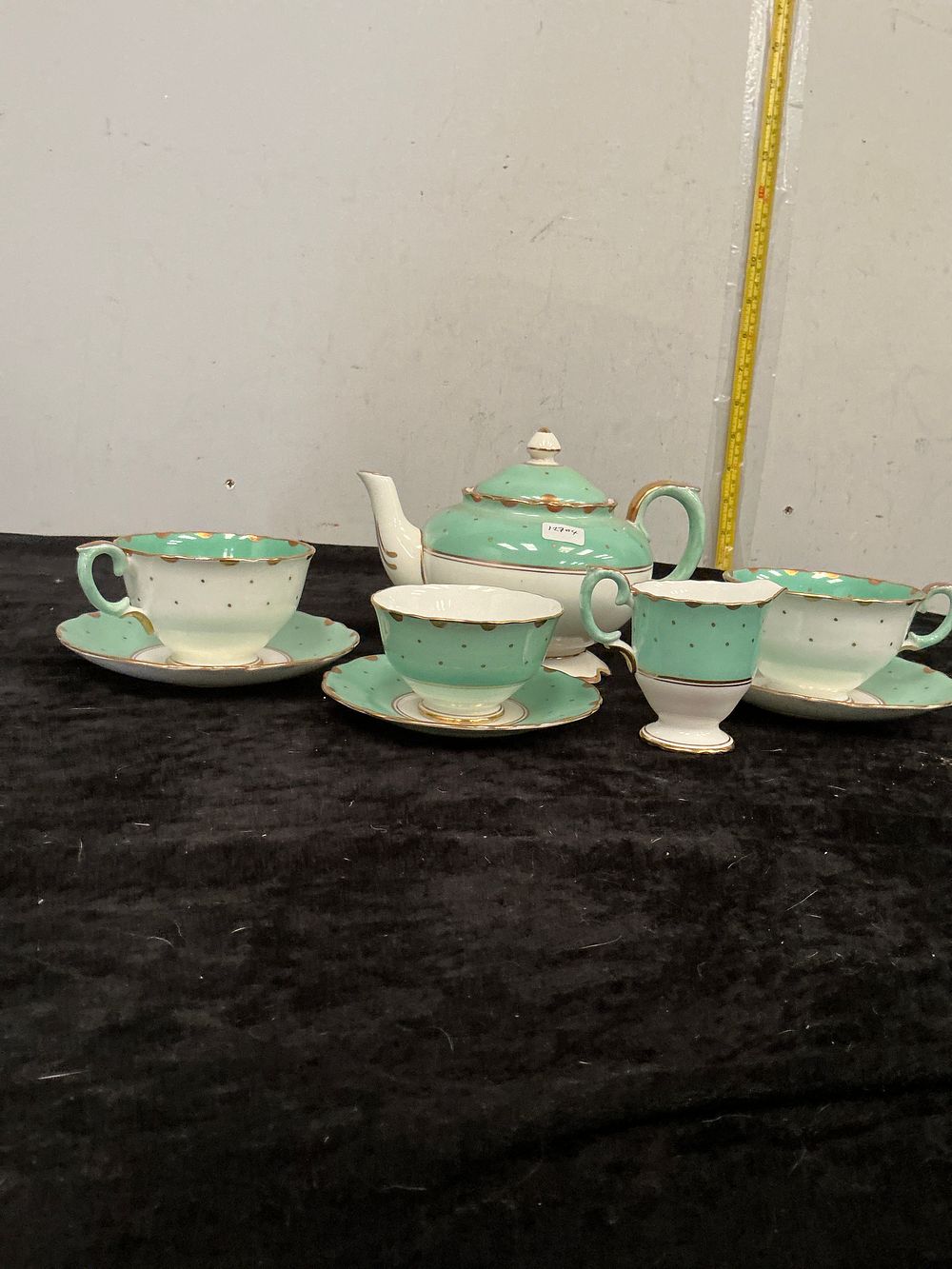 Lot 351: A Crown Staffordshire Miniature Bone China Tea Set in Mint Green and Gilded Polka Dot Pattern