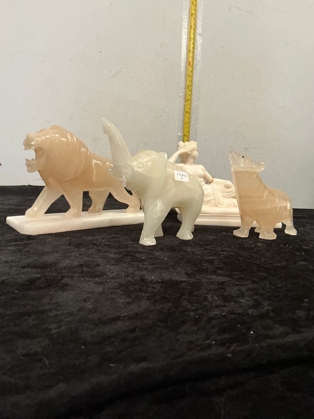 Lot 354: A Hand-Carved Alabaster and Onyx Figural Group of Animals and a Classical Figure