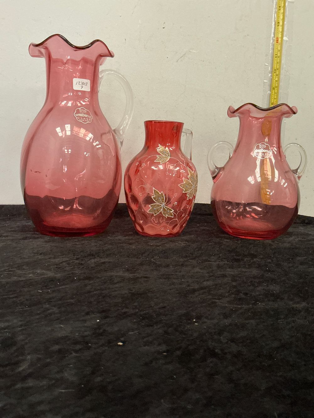 Lot 360: A Trio of Cranberry Glass Jugs including Royal Scot Glass and a Hand Painted Example