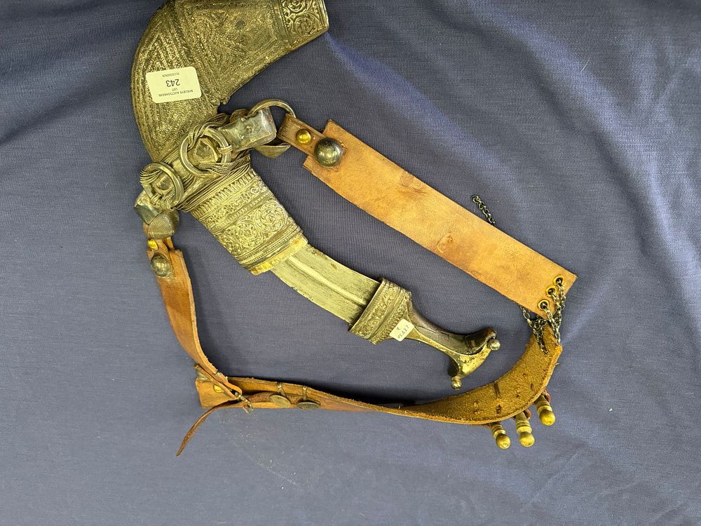Lot 243: An Omani-Style Silver-Mounted Jambiya Dagger and Leather Belt with British Indian Coinage