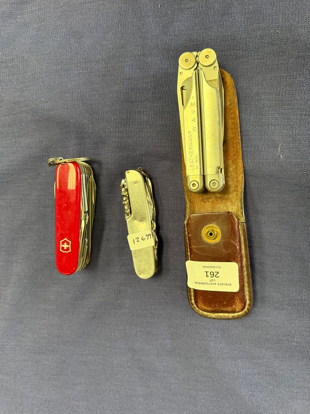 Lot 261: A Trio of Folding Multi-Tools including a Leatherman Wave