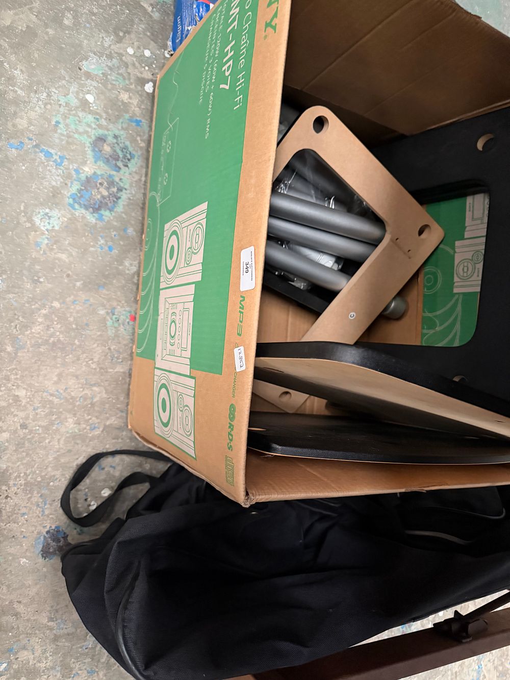 Lot 349: An Assortment of Flat-Packed Furniture Components and a Black Fabric Bag (television stand)