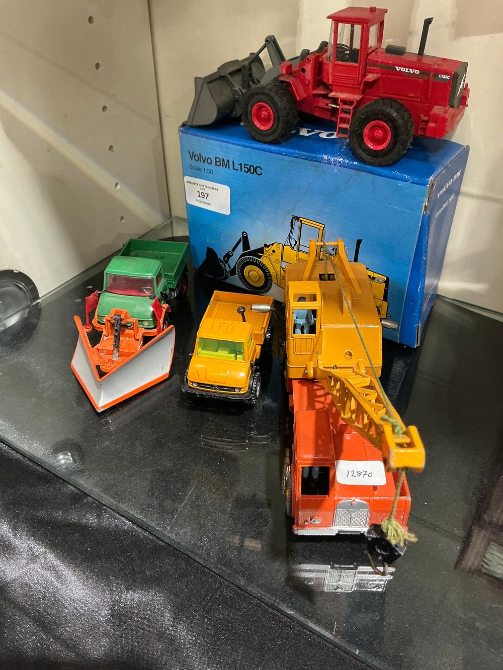 Lot 197: A Collection of Die-Cast Construction and Utility Vehicles including a Boxed Volvo BM L150C Loader corgi and dinky