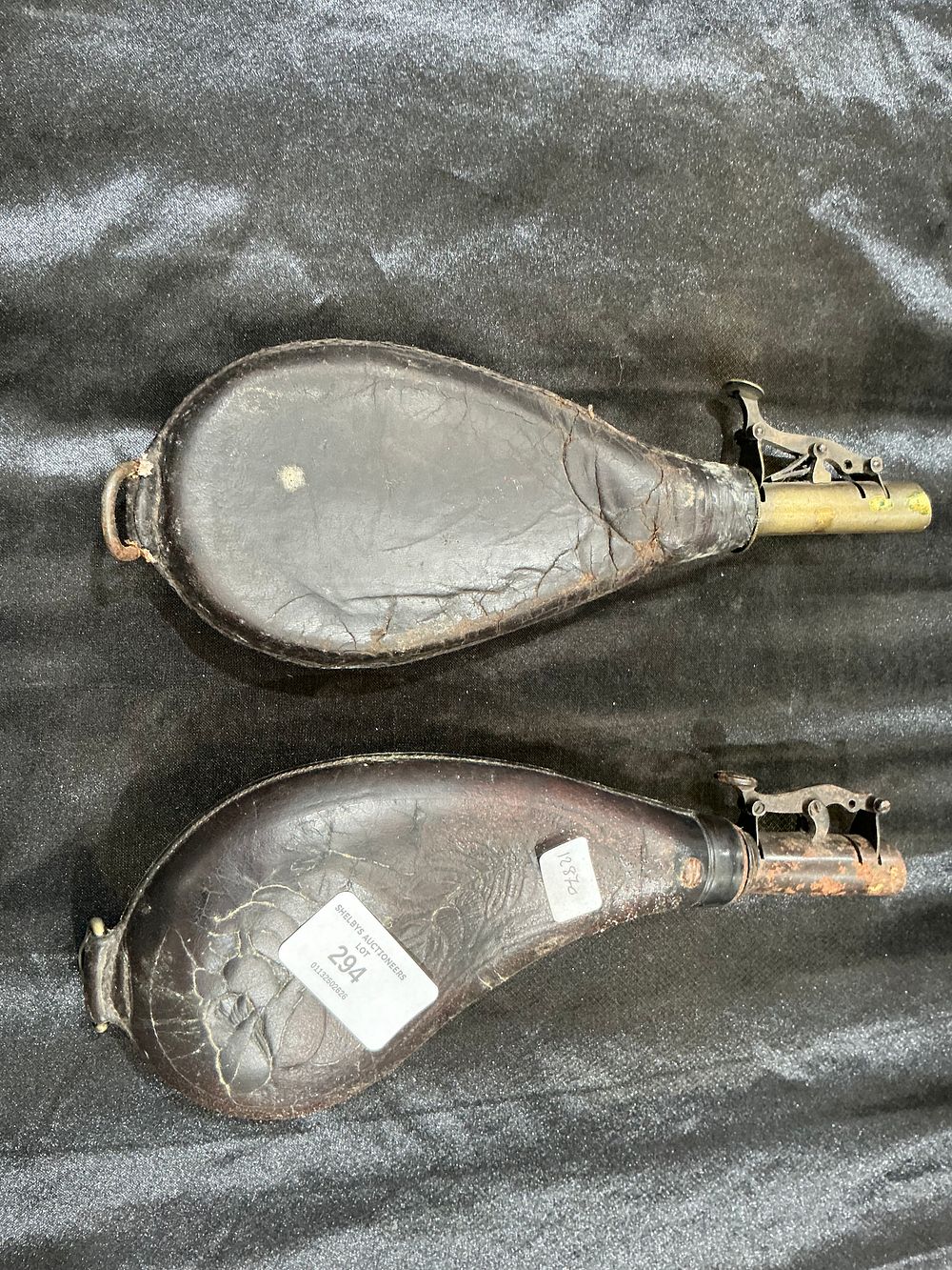 Lot 294: A Pair of Antique Leather Powder Flasks