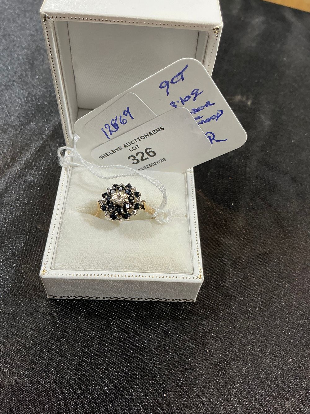 Lot 326: A 9ct Yellow Gold Sapphire and Diamond Cluster Ring