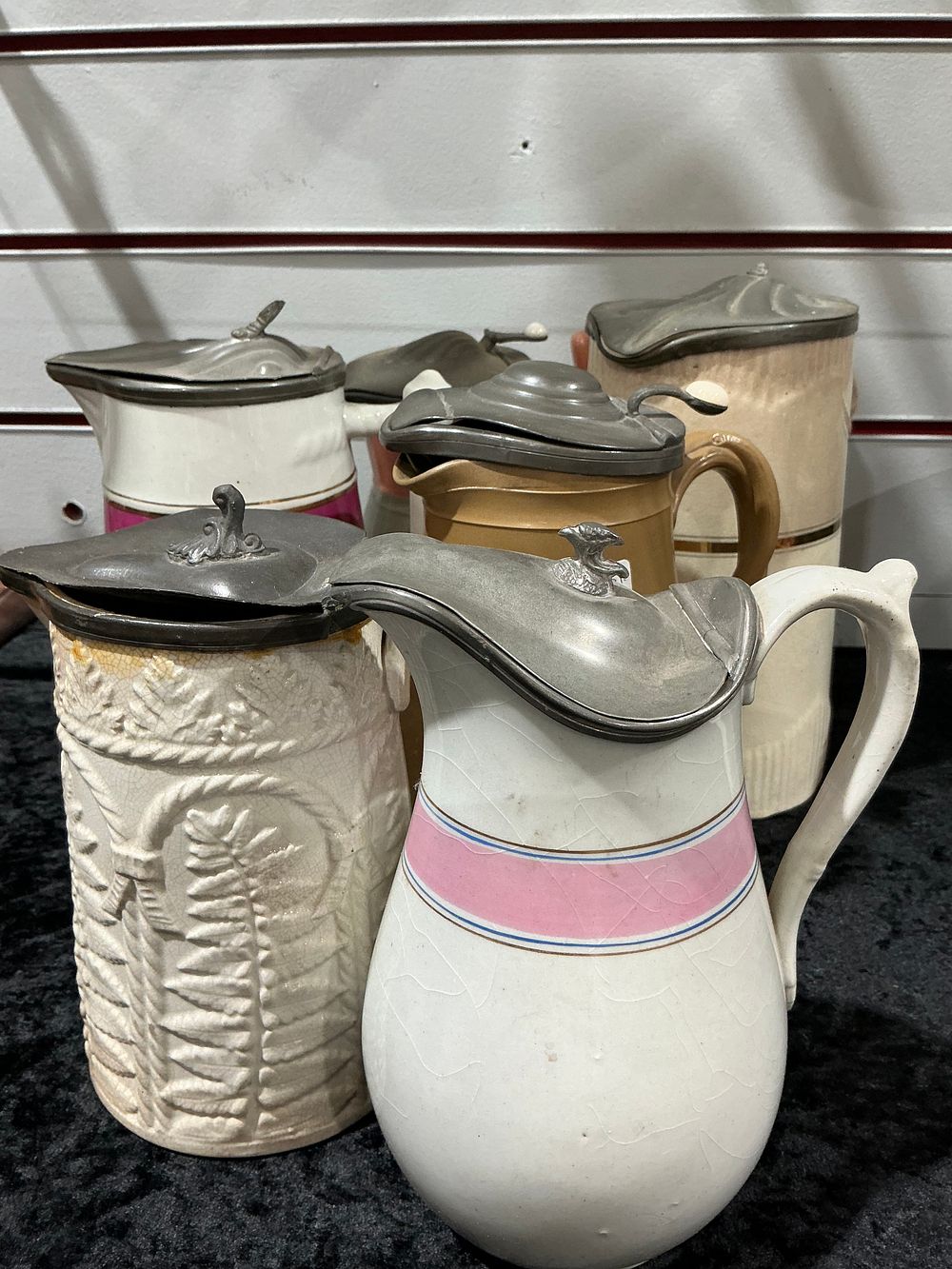 Lot 370: A Group of Victorian-Style Ceramic Lidded Pitchers and Steins