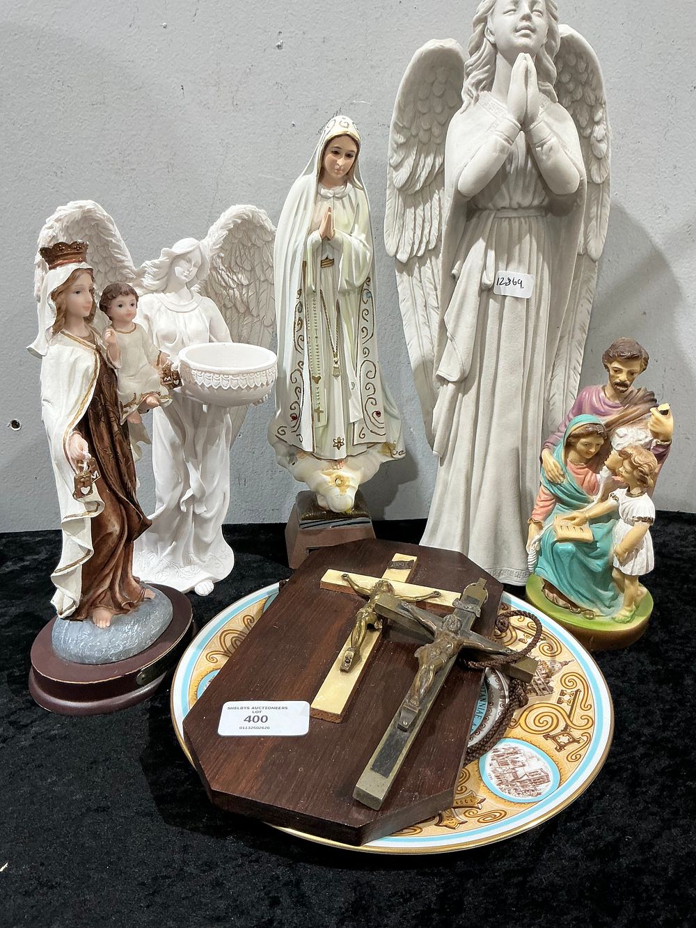 Lot 400: A Collection of Religious Figures, a Crucifix, and a Decorative Plate