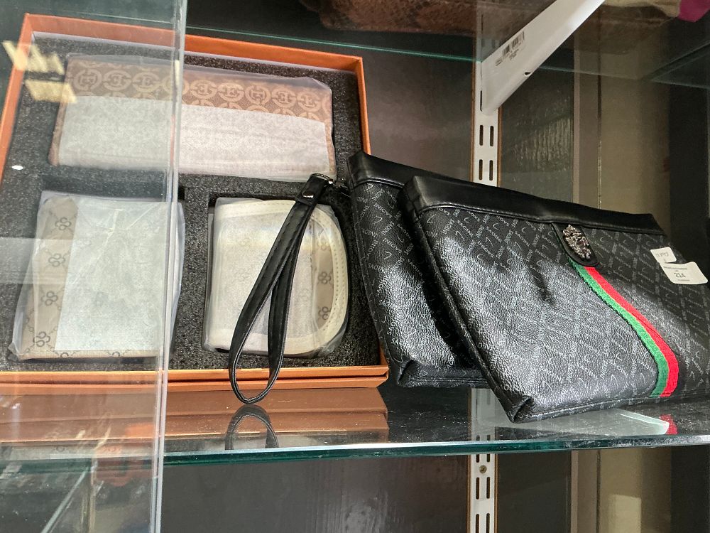 Lot 214: A Collection of Fashion Accessories Including a Boxed Wallet Set and Saioni Pattern Clutches