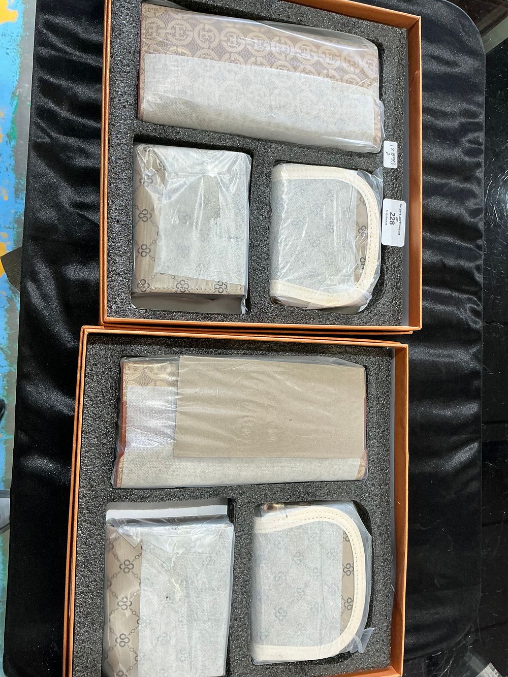 Lot 228: A Pair of Accessory Presentation Sets purses