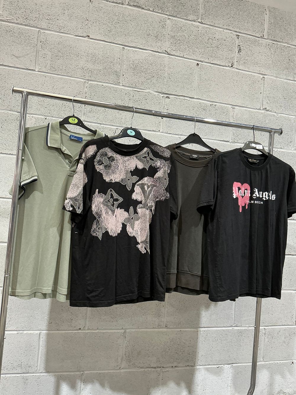 Lot 270: An Assortment of Contemporary Designer and Streetwear Garments including Fred Perry, Fendi, and Palm Angels style garments