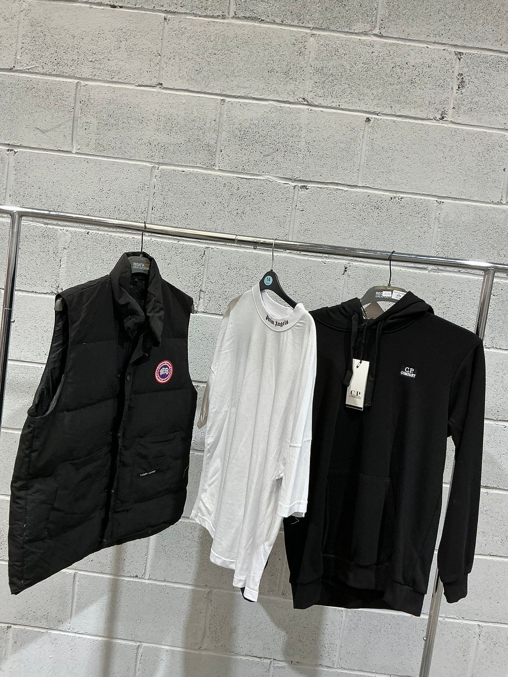Lot 275: A Trio of Apparel Including a C.P. Company Hoodie and a Palm Angels T-shirt inspired style
