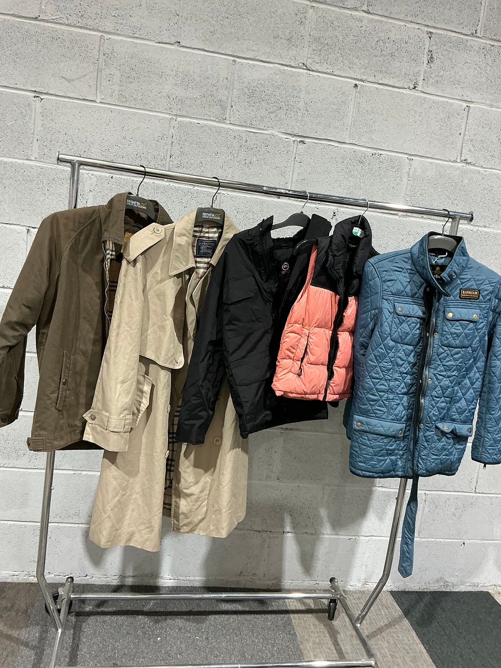 Lot 280: A Collection of Outdoor Jackets and Coats Including Burberrys, Barbour, and Canada Goose inspired design jackets .