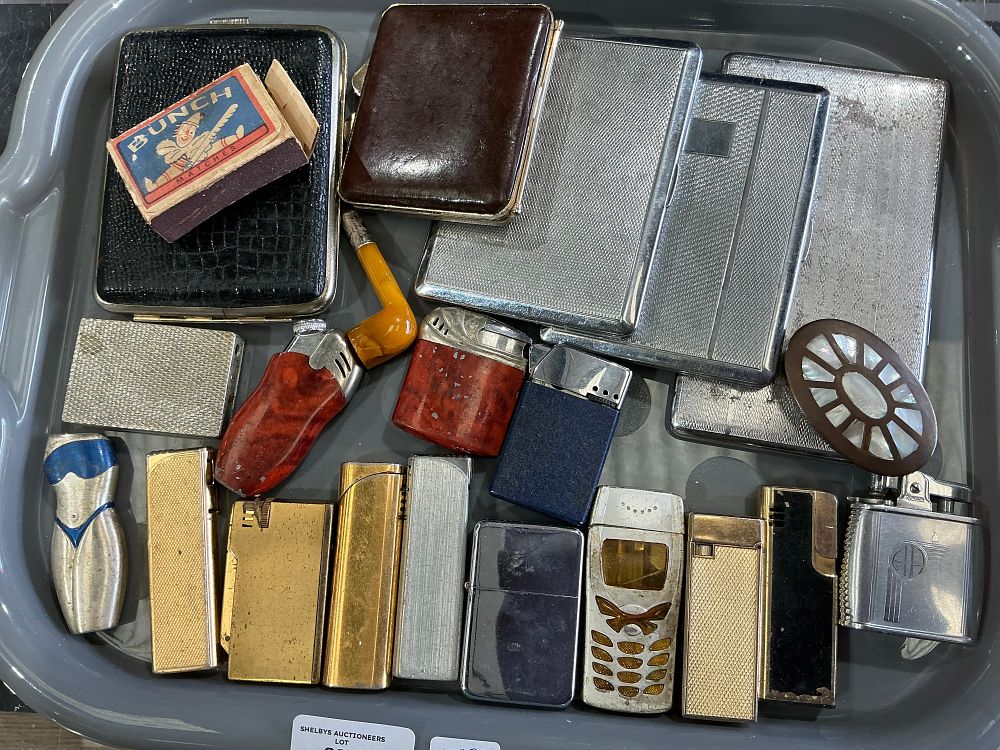 Lot 303: An Assortment of Vintage Smoking Accessories including Lighters and Cigarette Cases