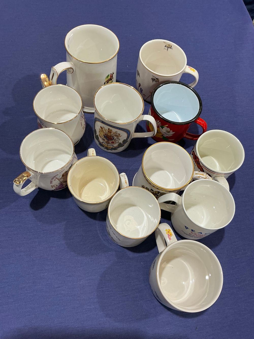 Lot 336: A Collection of British Royal and Historical Commemorative Mugs and Beakers