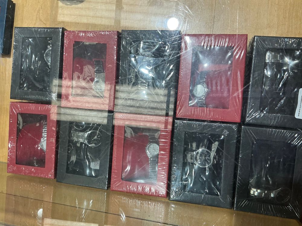 Lot 438: An Assortment of Quartz Wristwatches in Presentation Boxes