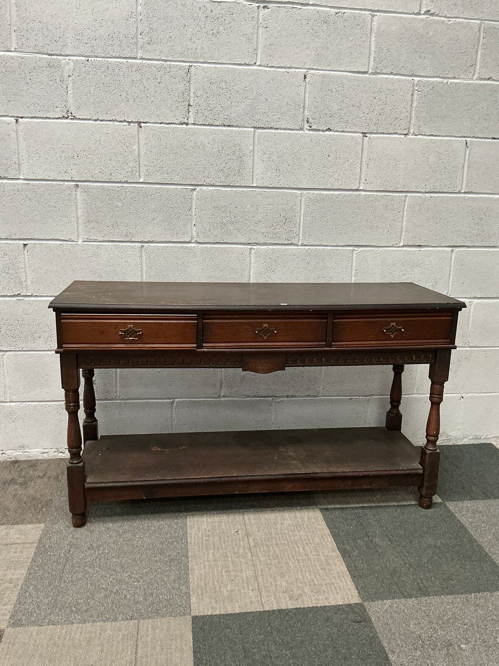 Lot 30: A Reproduction Oak Three Drawer Dresser Base in the Jacobean Style