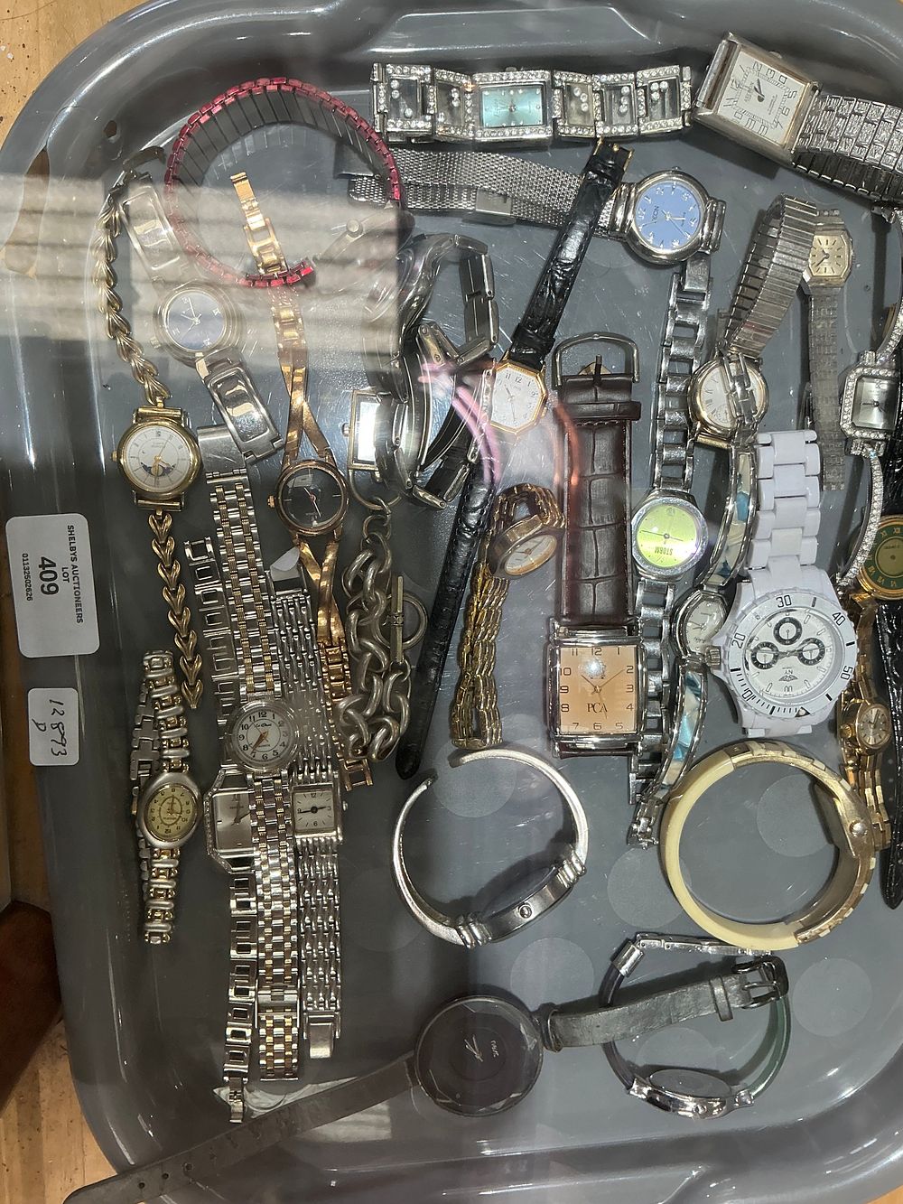 Lot 130: An Assortment of Wristwatches and Fashion Jewellery Bangles