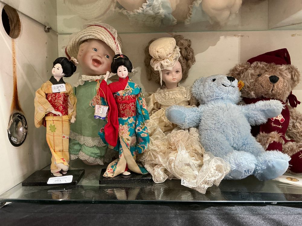 Lot 210: An Assortment of Bisque Porcelain and Plush Dolls and Teddy Bears including a steiff bear