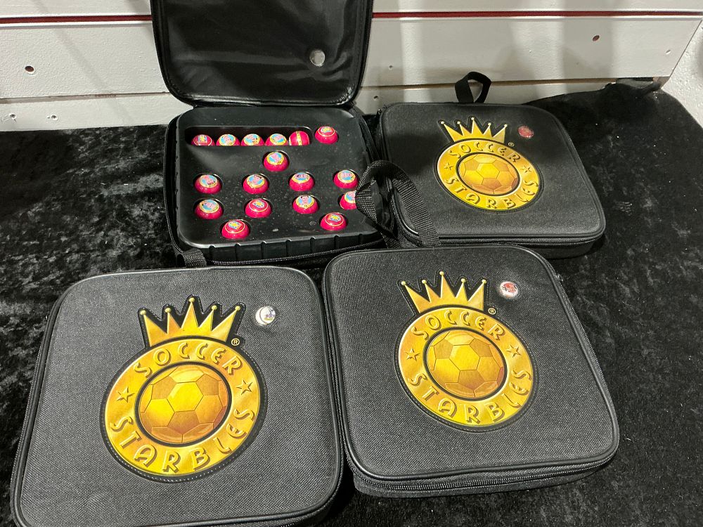 Lot 213: A Collection of Soccer Starbles Game Cases and Pieces