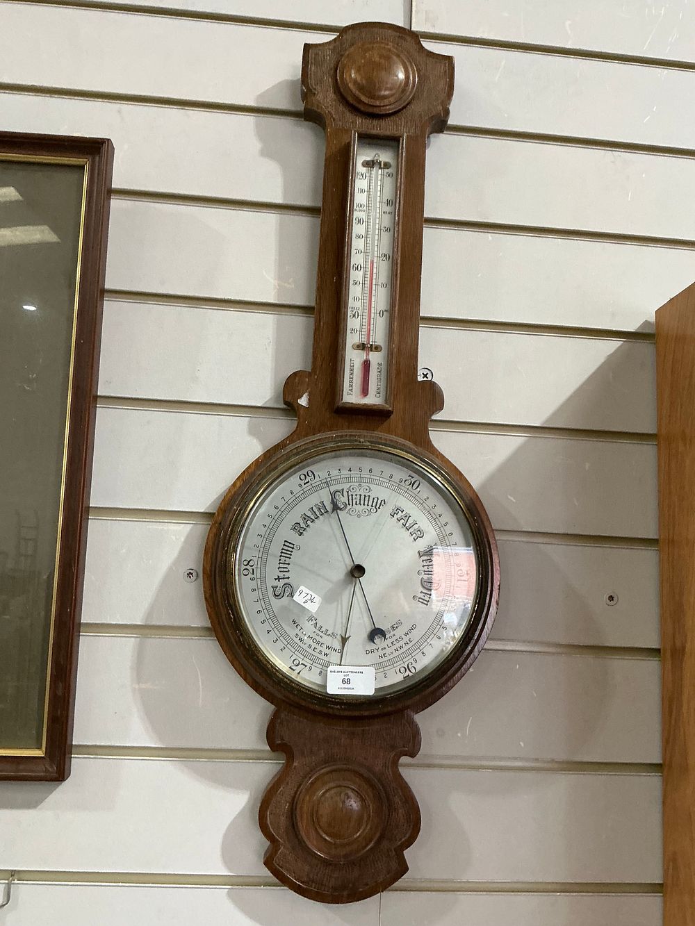 Lot 203: An Edwardian Carved Oak Banjo Barometer and Thermometer