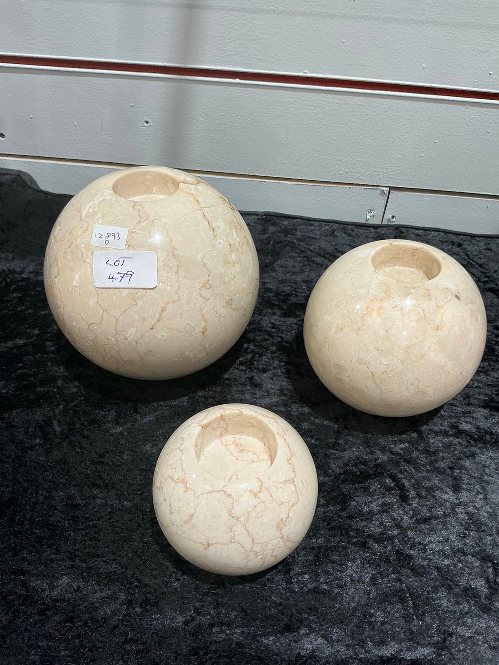 Lot 269: A Trio of Polished Marble Spherical Votive Holders