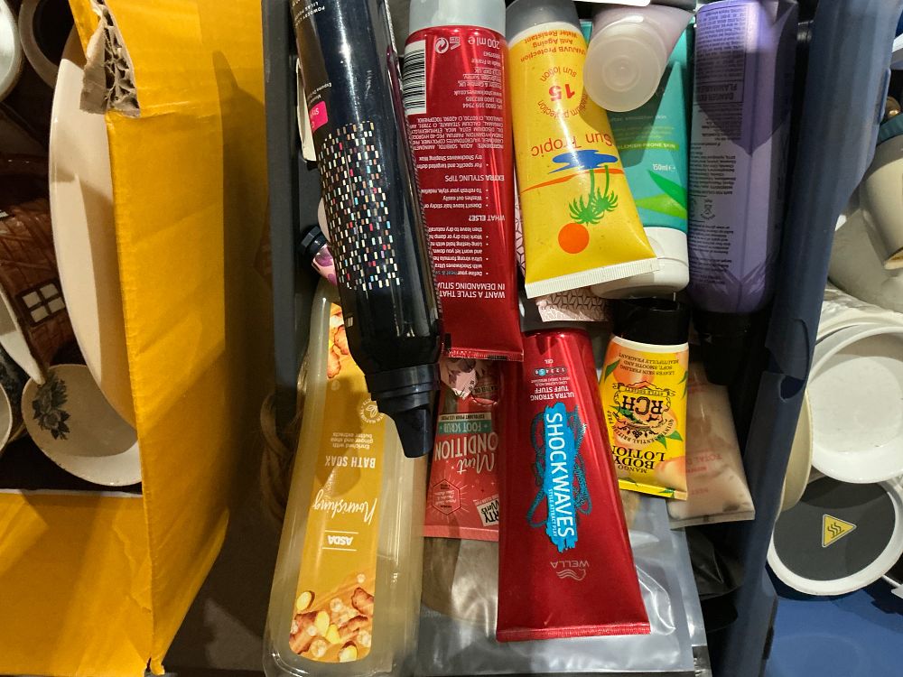 Lot 286: An Assortment of Personal Care Products and Toiletries including Wella and Sun Tropic