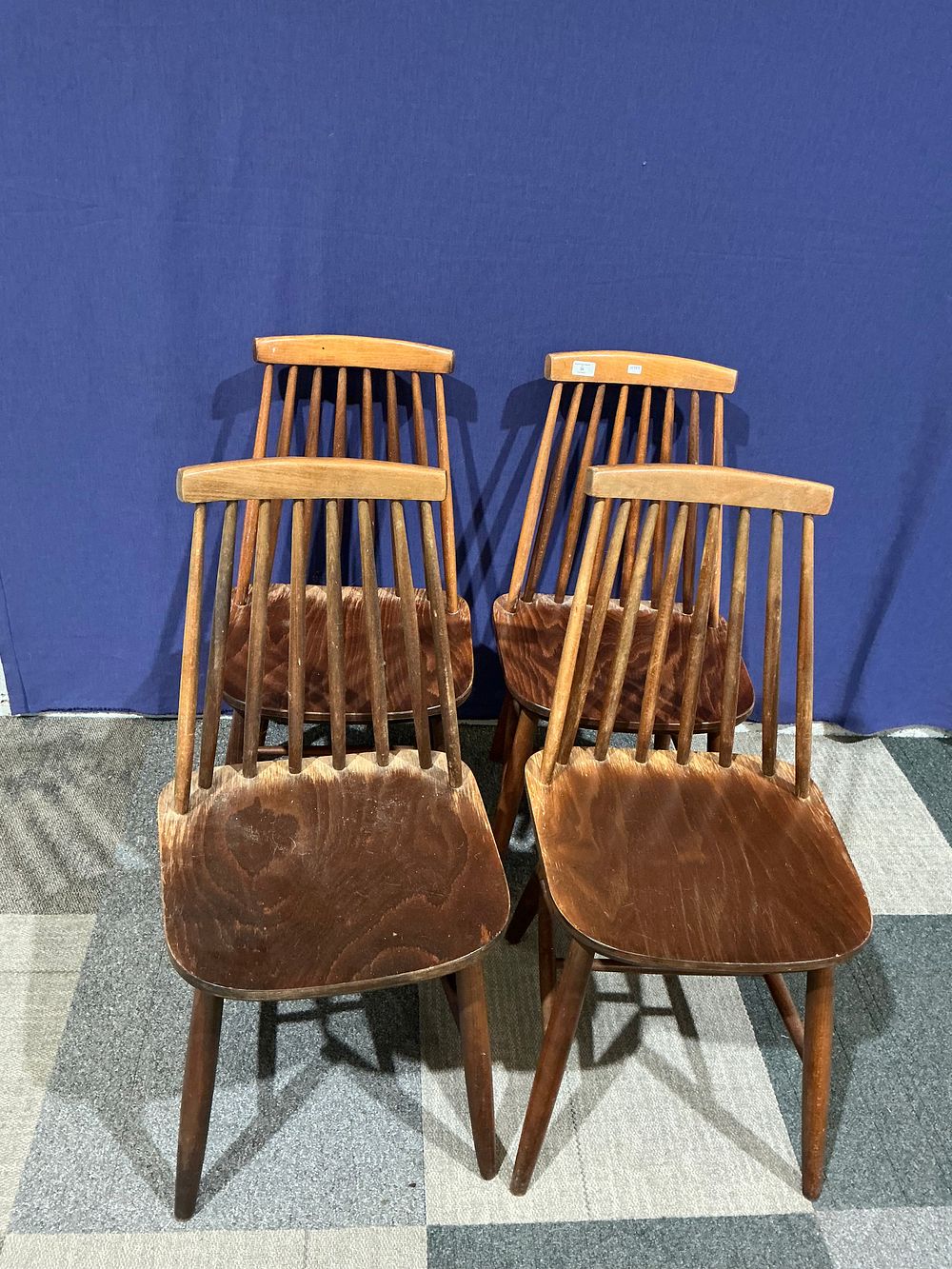 Lot 38: A Set of Four Mid-Century Modern Stained Spindle-Back Dining Chairs