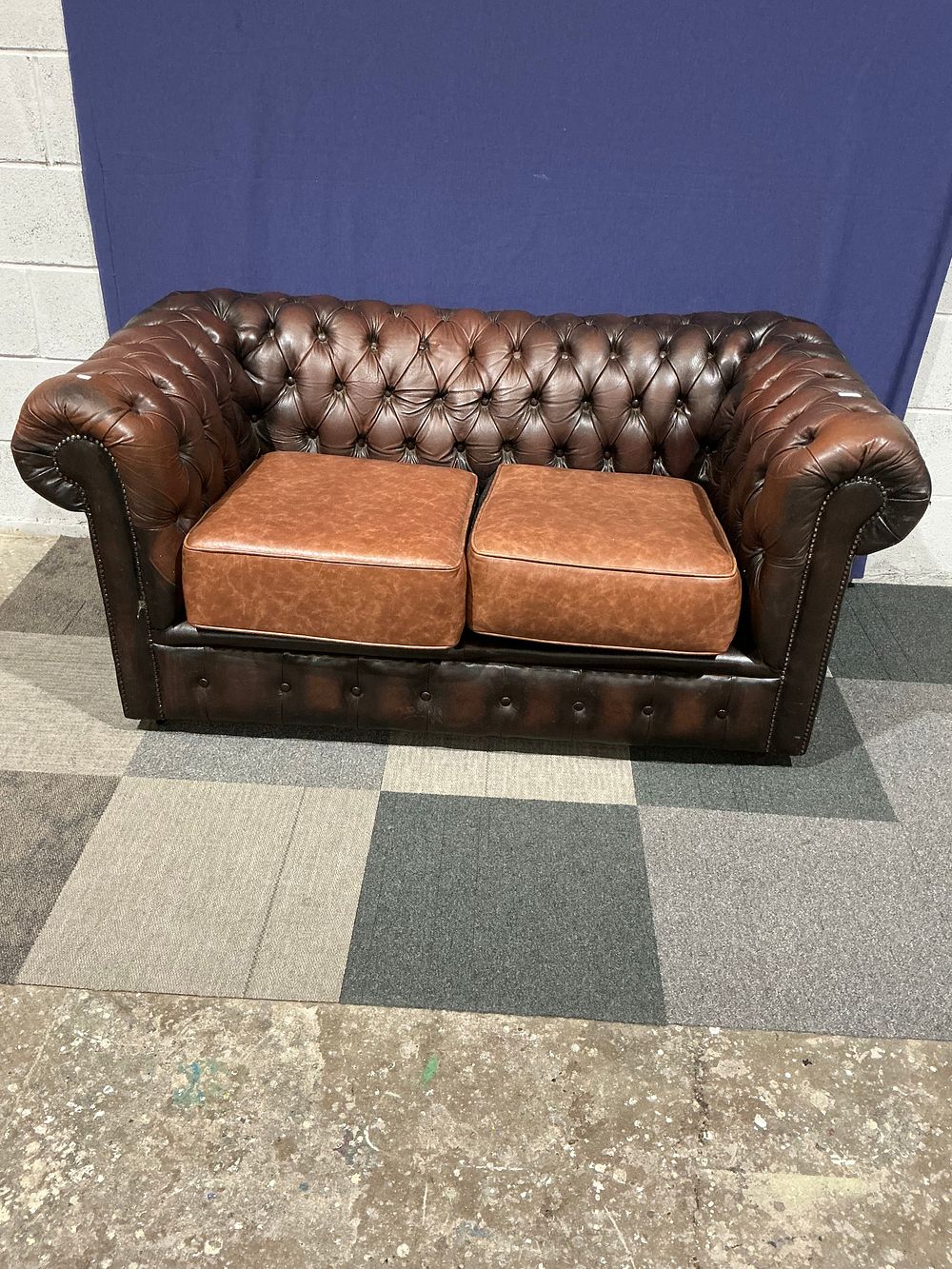 Lot 83: Chesterfield Two-Seater Leather Sofa with Contrasting Cushions