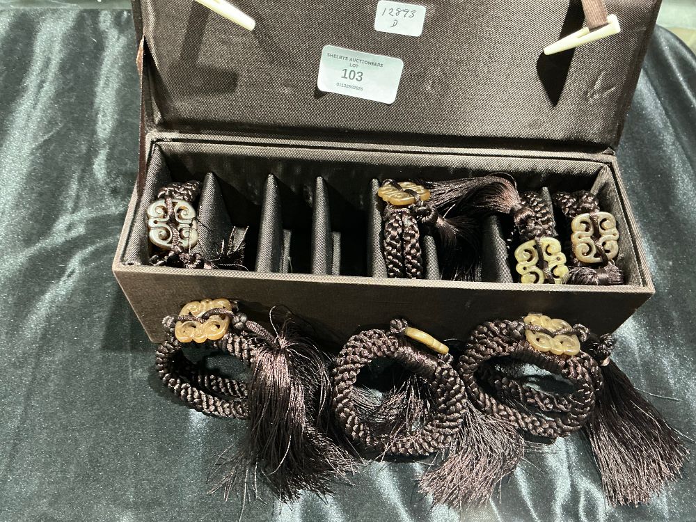 Lot 103: A set of six jade 'ruyi' napkin rings, 20th century or later