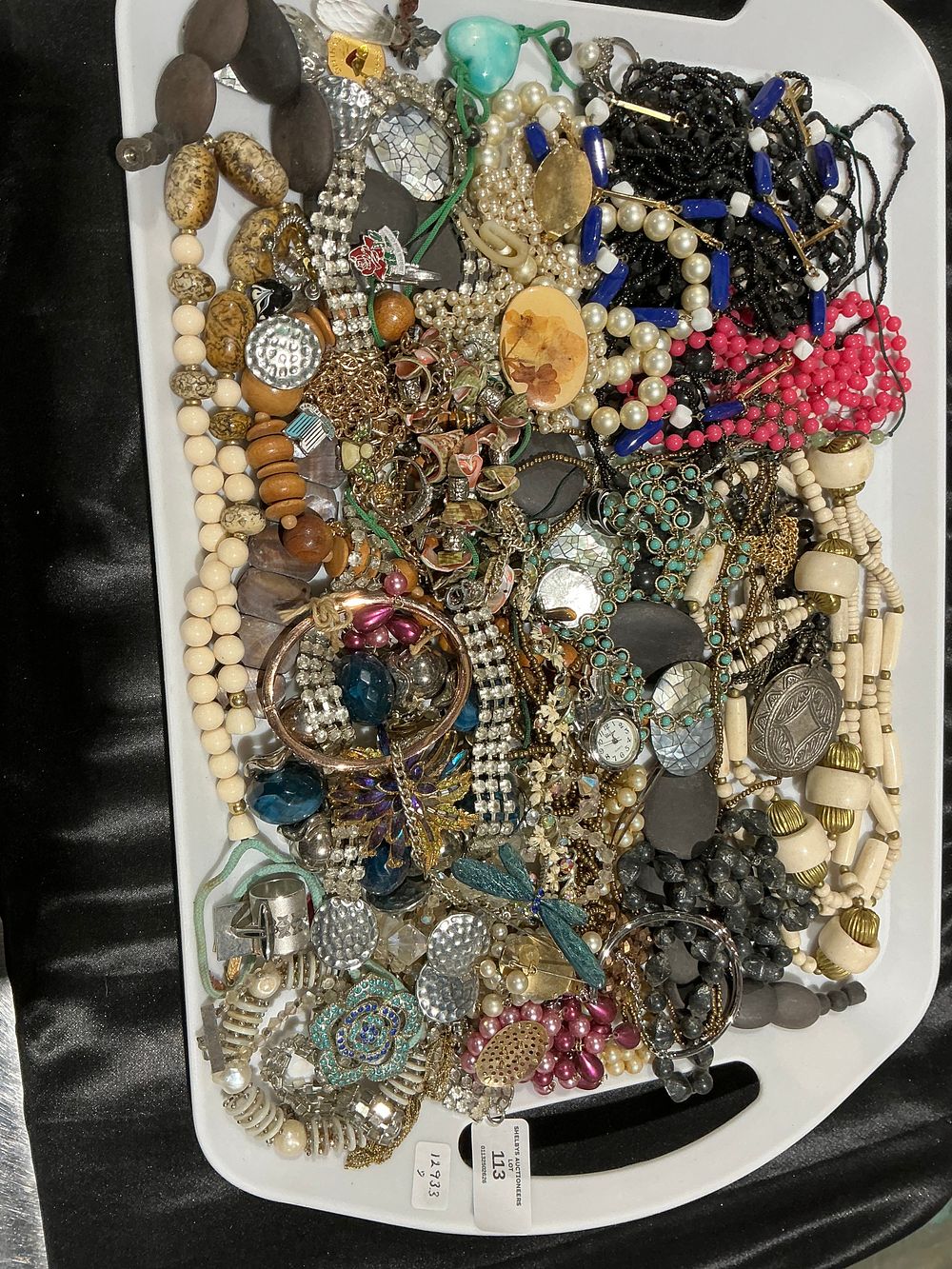 Lot 113: An Assortment of Vintage Costume Jewellery Including Necklaces, Bracelets, and Brooches