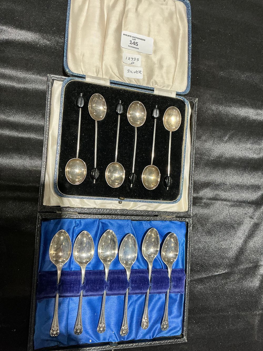 Lot 145: Two Cased Sets of Hallmarked Sterling Silver Coffee and Teaspoons
