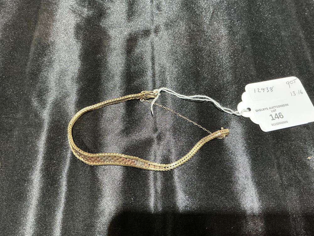 Lot 146: A 9 Carat Tricolour Gold Herringbone Link Bracelet 13.16 gram