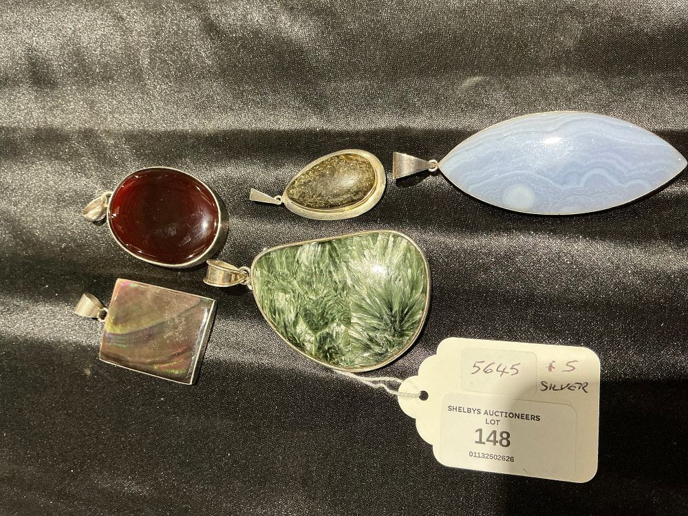 Lot 148: A Collection of Five White Metal Gemstone Pendants