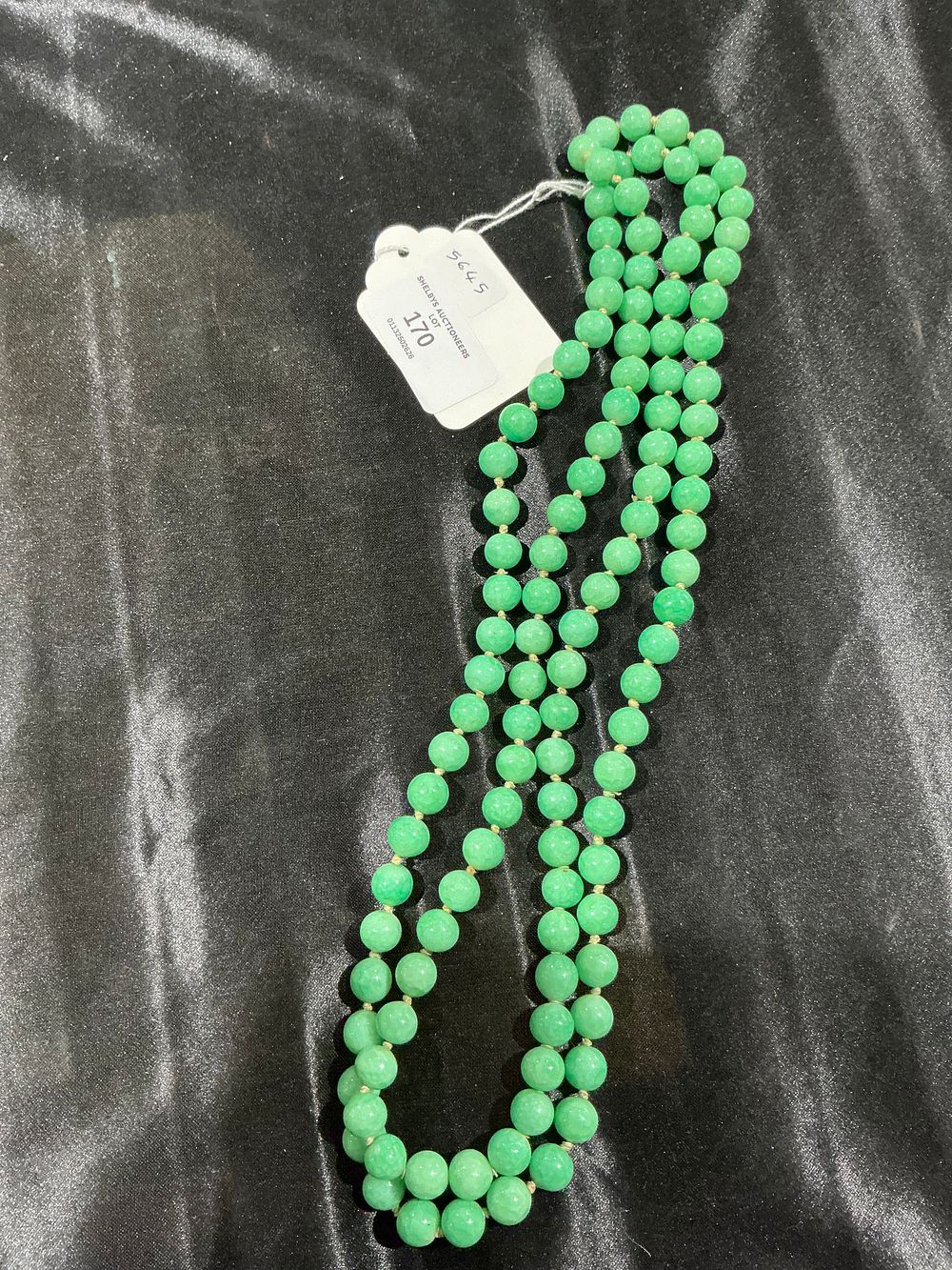 Lot 170: Long Hand-Knotted Strand of Mottled Green Stone Beads
