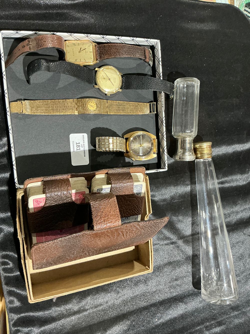 Lot 181: A Group of Vintage Watches, Vanity Bottles, and Playing Cards